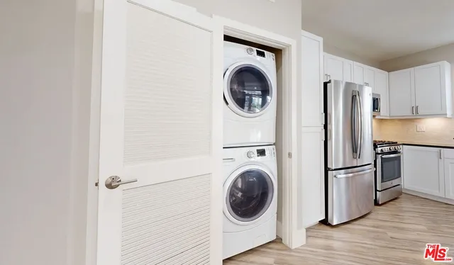a view of a kitchen with washer and dryer