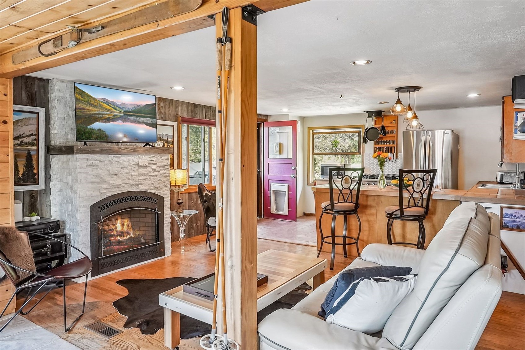 57 L Road Silverthorne, CO 80498 - Photo 6 of 38 Living room, a fireplace, and wood flooring