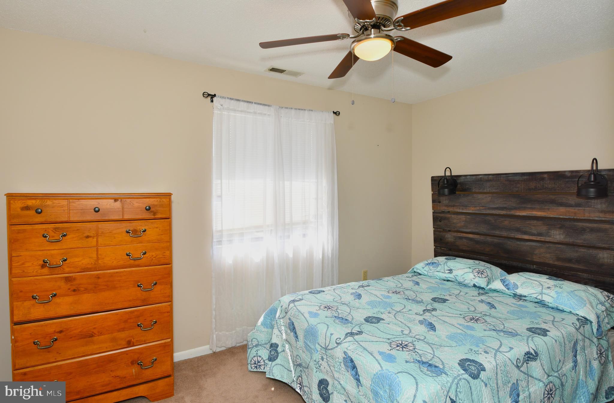 9815 Stephen Decatur Highway, Unit 3 Ocean City, MD 21842 - Photo 14 of 23 a bedroom with a bed and a closet