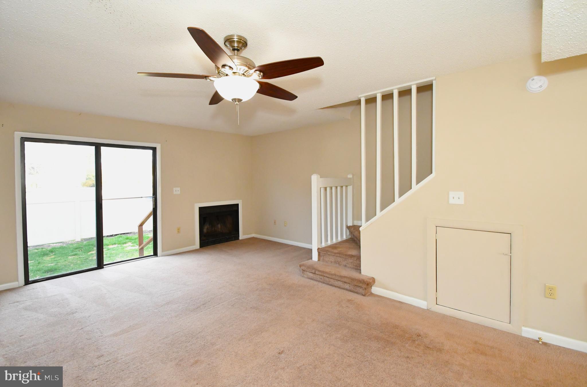 9815 Stephen Decatur Highway, Unit 3 Ocean City, MD 21842 - Photo 3 of 23 a view of a livingroom with a ceiling fan and window