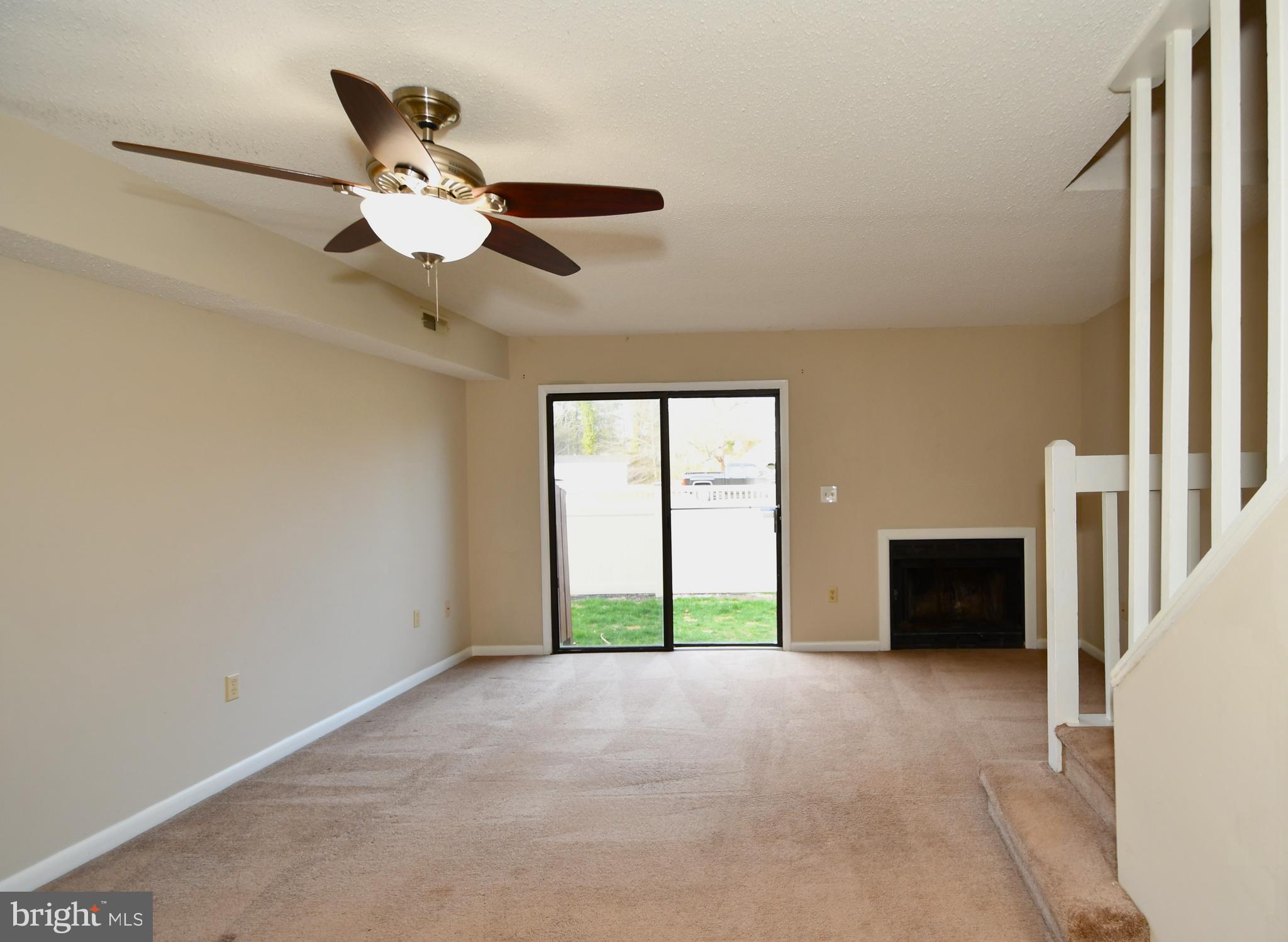 9815 Stephen Decatur Highway, Unit 3 Ocean City, MD 21842 - Photo 4 of 23 a view of a livingroom with a ceiling fan and window