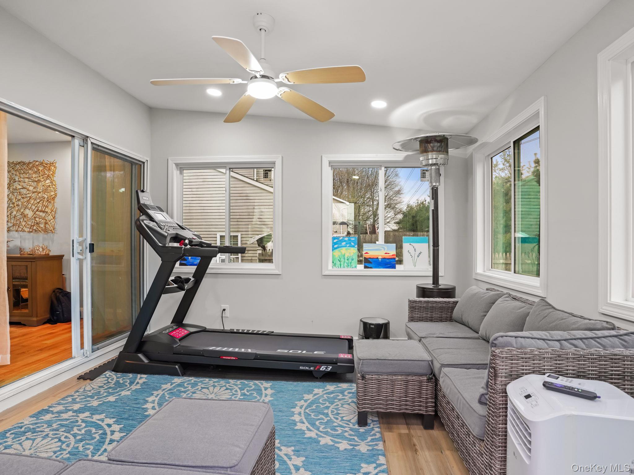 38 Kathwood Road White Plains, NY 10607 - Photo 18 of 44 Enclosed deck with wood finished floors and a ceiling fan
