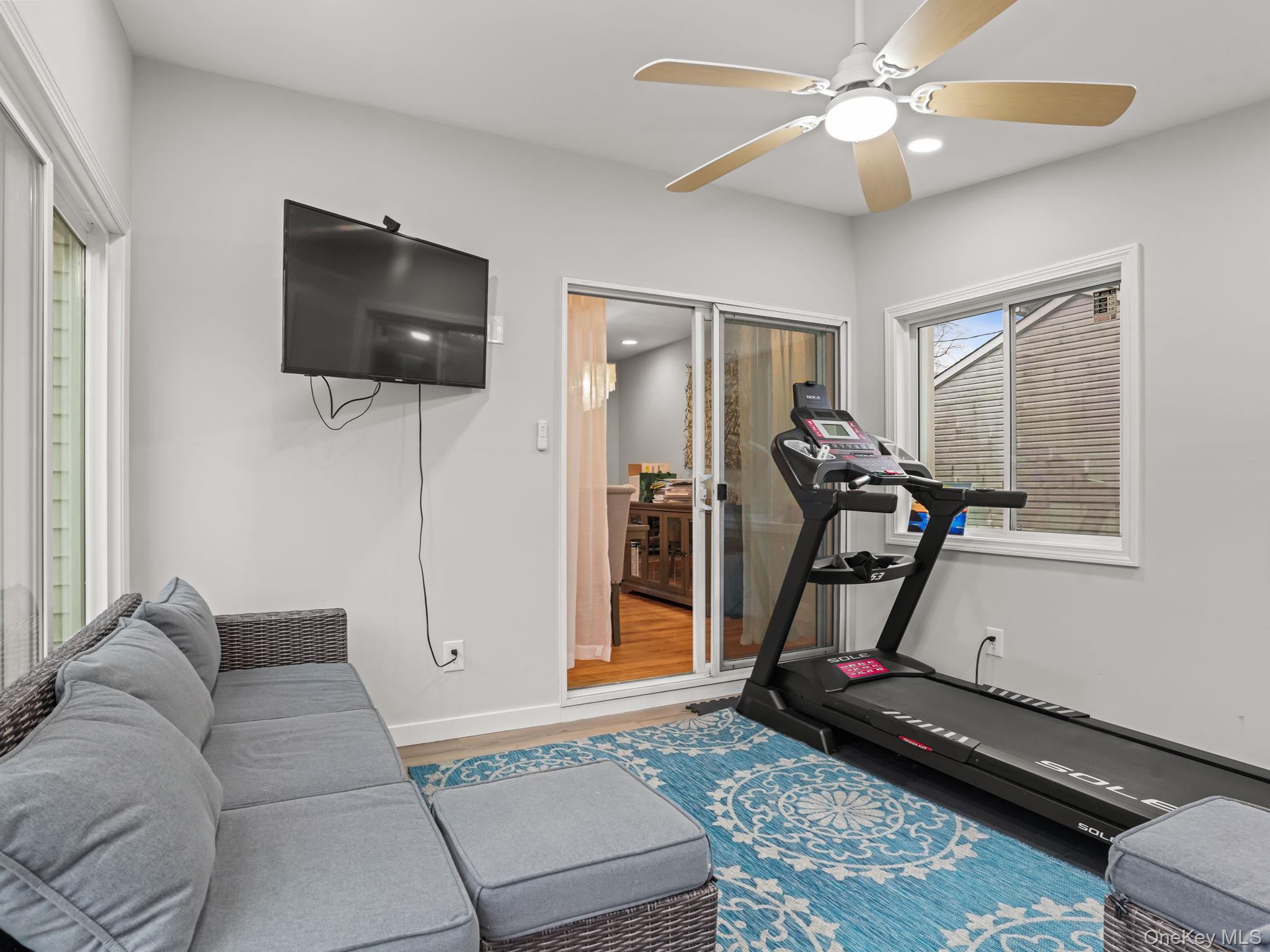 38 Kathwood Road White Plains, NY 10607 - Photo 19 of 44 Enclosed deck with wood finished floors, a ceiling fan, and recessed lighting