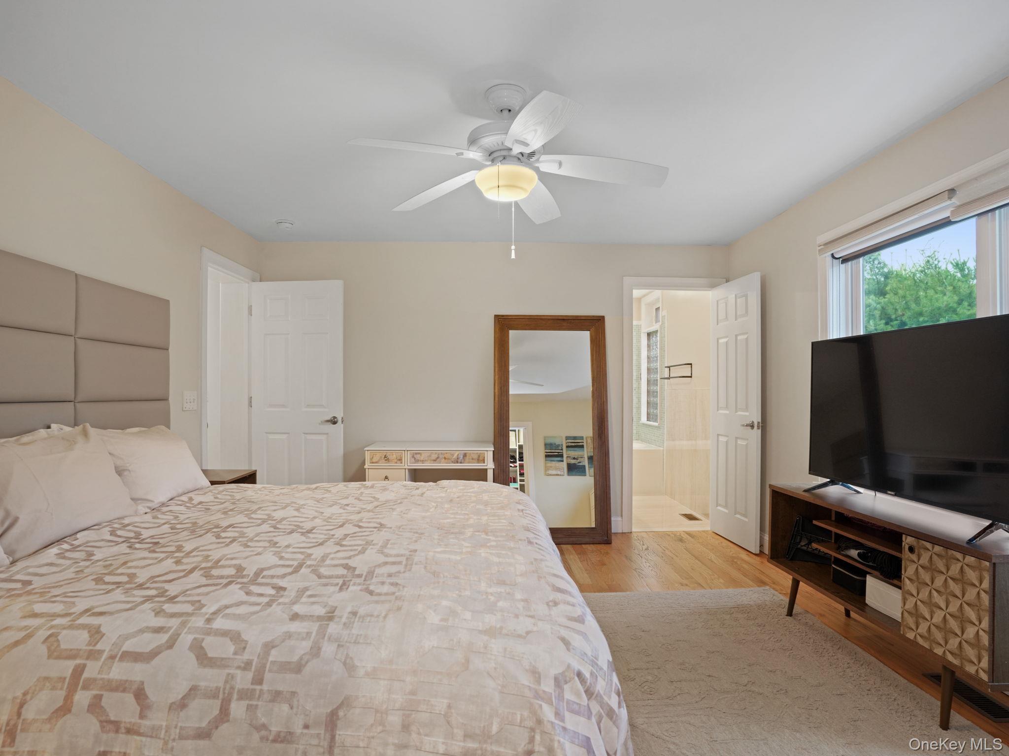 38 Kathwood Road White Plains, NY 10607 - Photo 26 of 44 Primary bedroom featuring light wood finished floors, ceiling fan, and ensuite bathroom