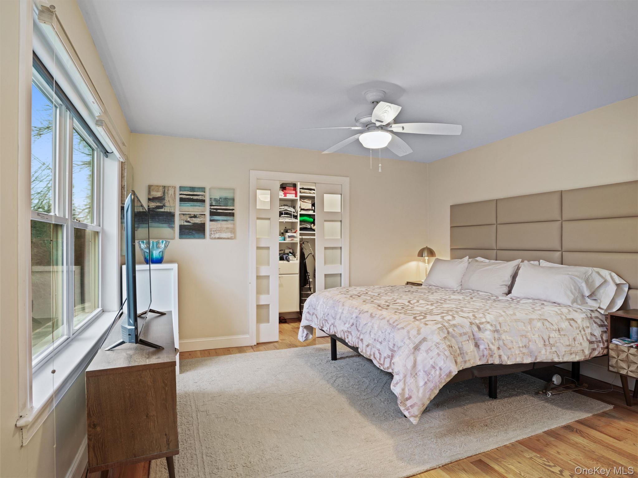 38 Kathwood Road White Plains, NY 10607 - Photo 27 of 44 Primary bedroom featuring light wood finished floors, a spacious closet, and ceiling fan