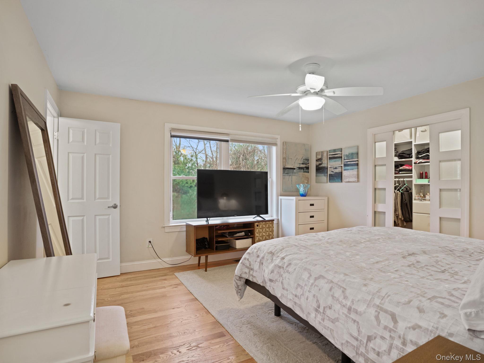 38 Kathwood Road White Plains, NY 10607 - Photo 28 of 44 Primary bedroom featuring hardwood / wood-style floors, a closet, and ceiling fan