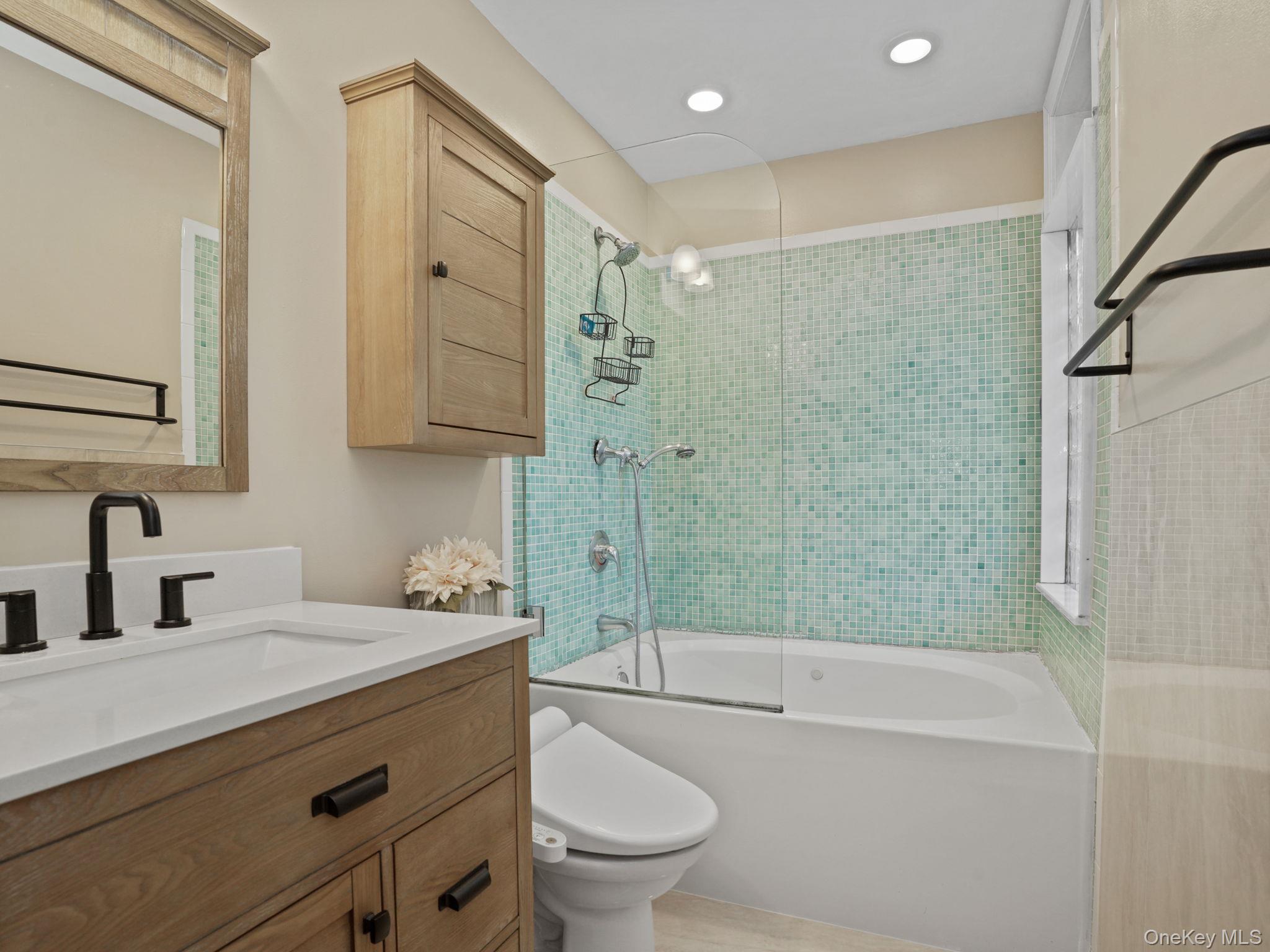 38 Kathwood Road White Plains, NY 10607 - Photo 29 of 44 Primary full bath with vanity, enclosed tub / shower combo, and recessed lighting