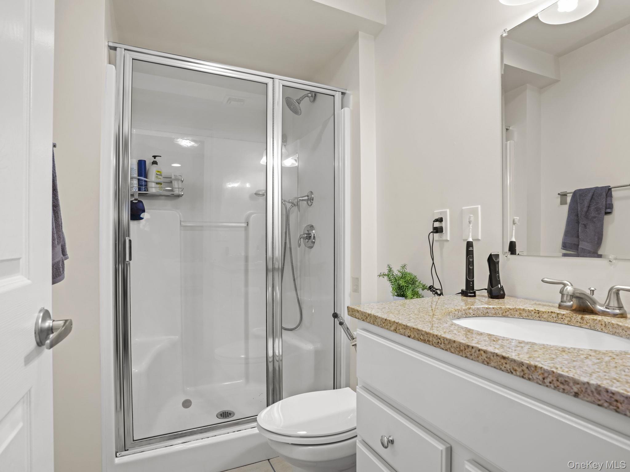 38 Kathwood Road White Plains, NY 10607 - Photo 37 of 44 Full bathroom with vanity, a shower stall, and light tile patterned flooring