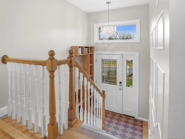 a view of entryway with wooden floor