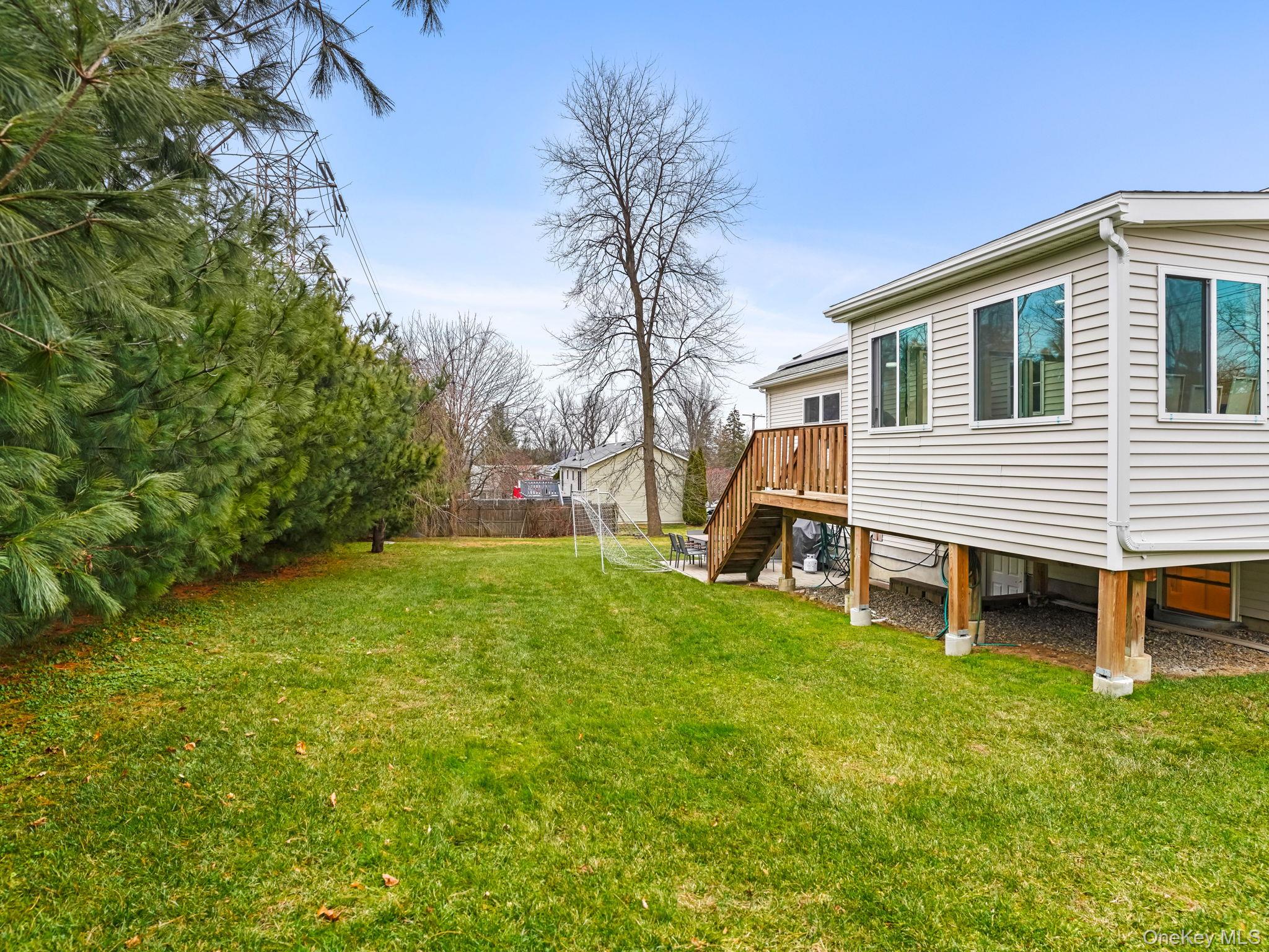 38 Kathwood Road White Plains, NY 10607 - Photo 40 of 44 View of yard with stairway and a wooden deck