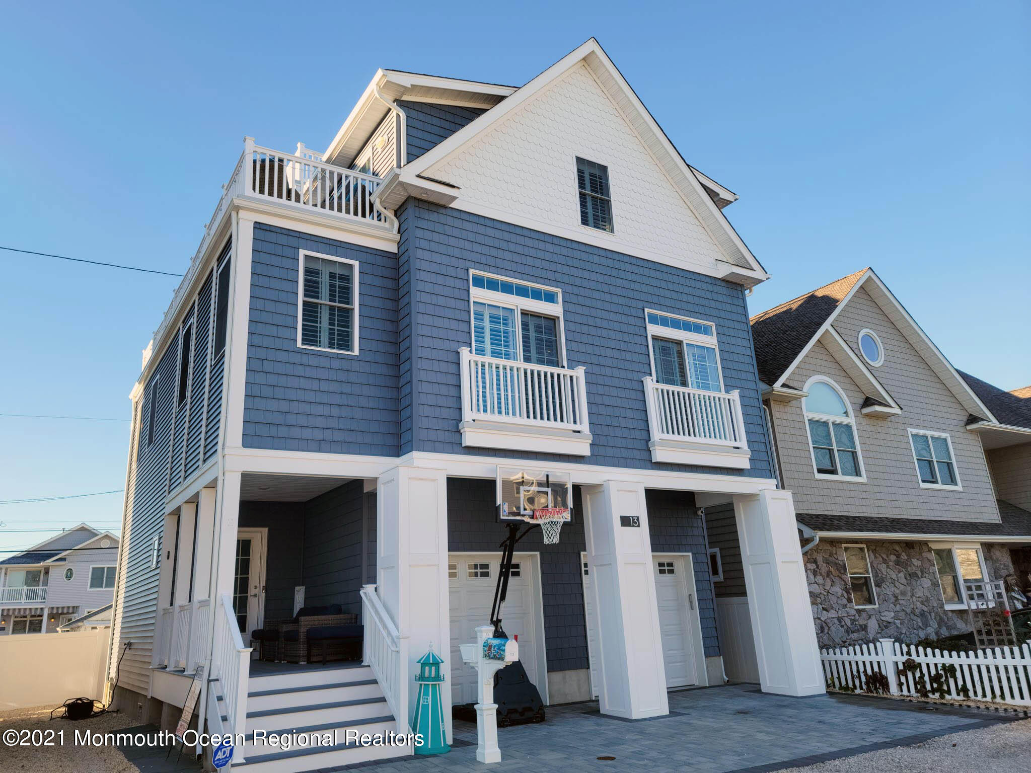 13 Surf Road Seaside Heights, NJ 08751 - Photo 2 of 64 a front view of a house with glass windows
