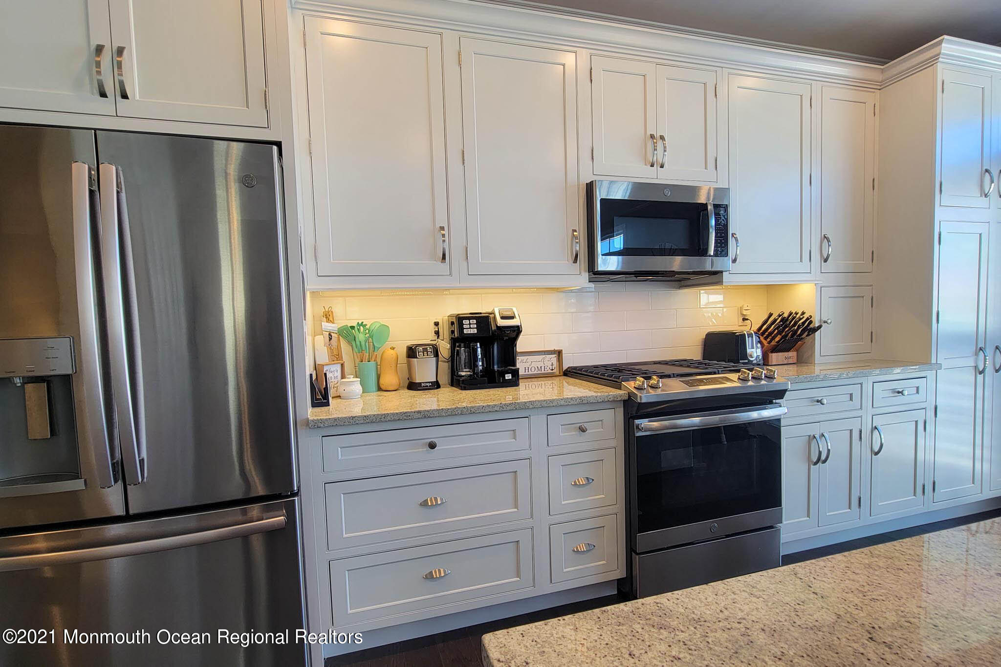 13 Surf Road Seaside Heights, NJ 08751 - Photo 24 of 64 a kitchen with cabinets stainless steel appliances and a counter space