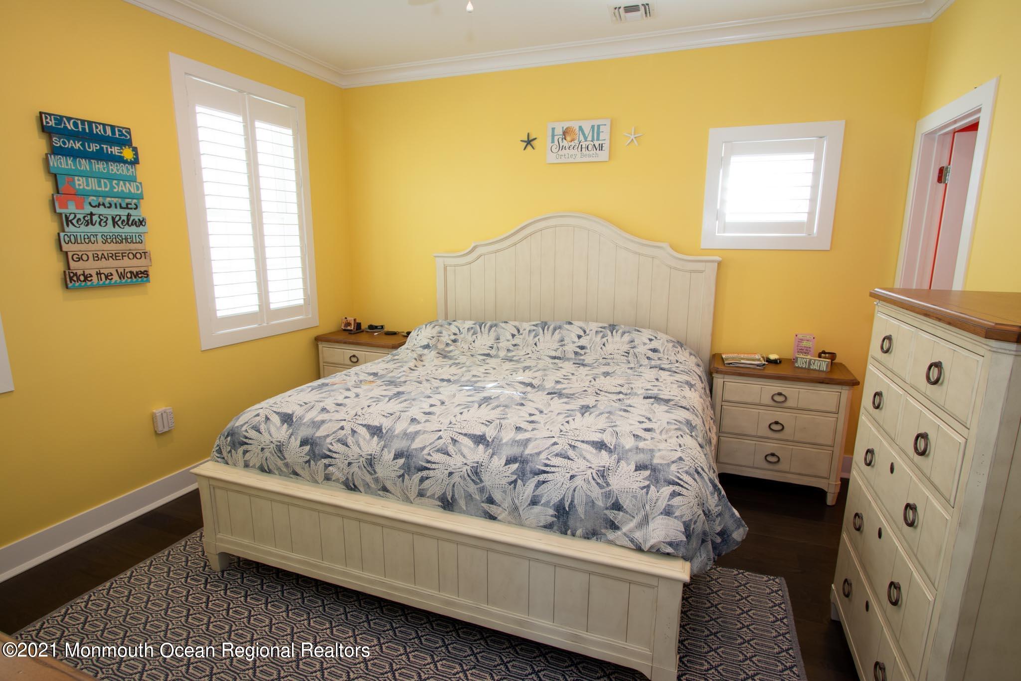 13 Surf Road Seaside Heights, NJ 08751 - Photo 28 of 64 a bed sitting in a bedroom next to a window