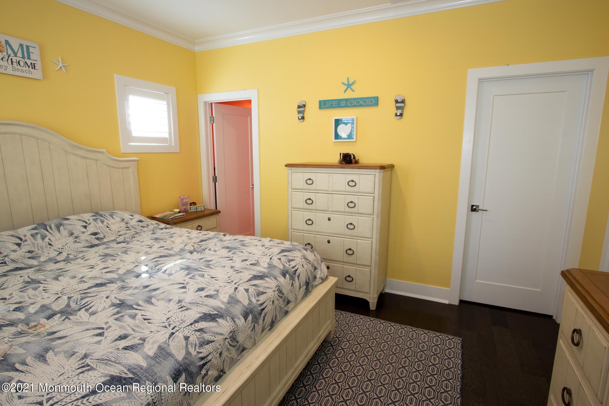 13 Surf Road Seaside Heights, NJ 08751 - Photo 29 of 64 a bedroom with a bed and a dresser