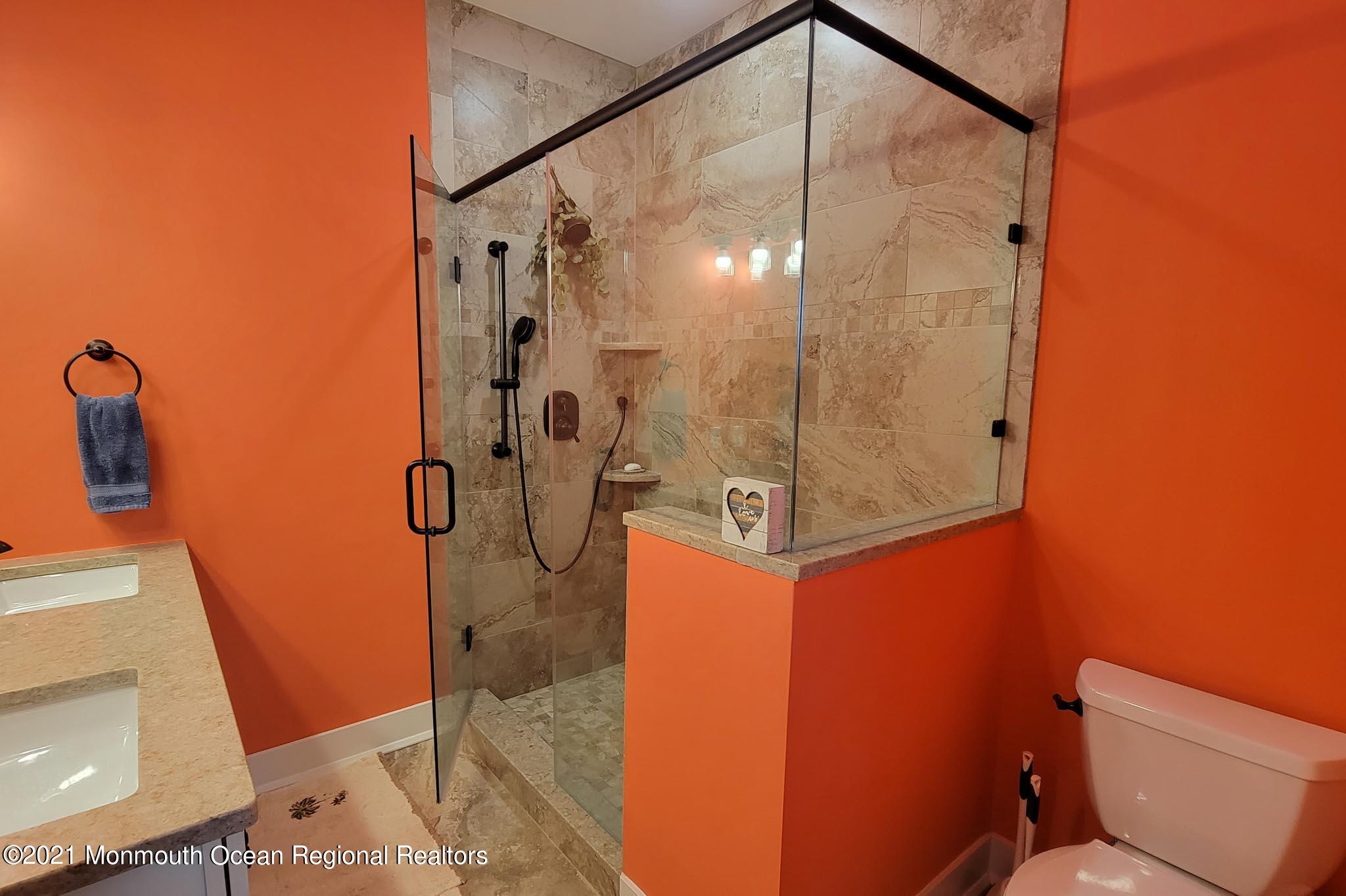 13 Surf Road Seaside Heights, NJ 08751 - Photo 31 of 64 a bathroom with a shower and toilet