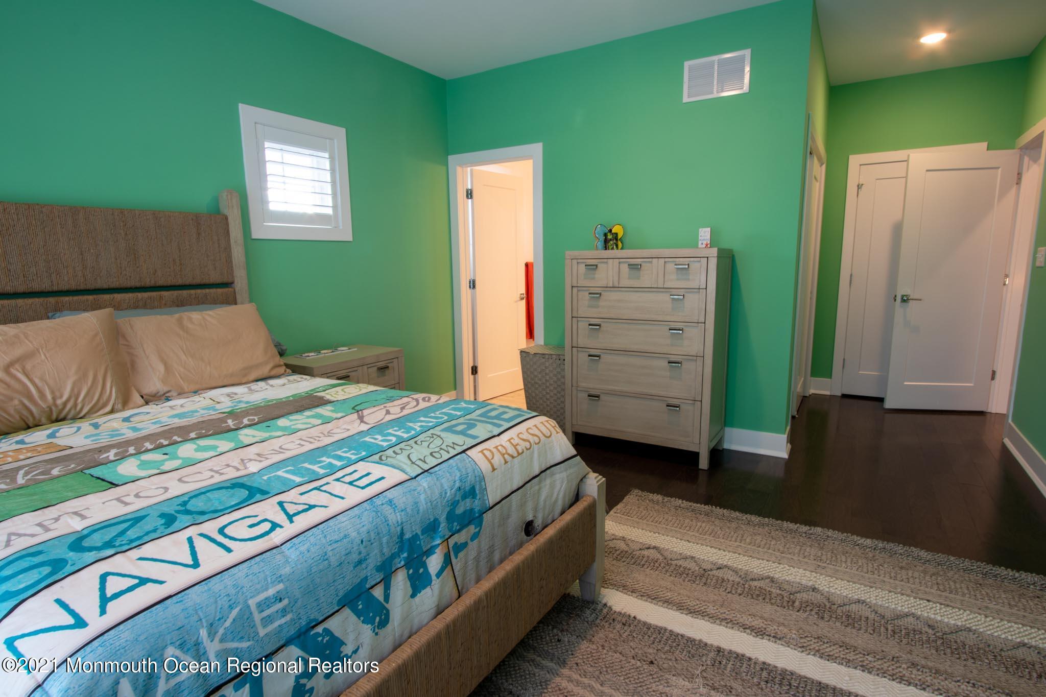 13 Surf Road Seaside Heights, NJ 08751 - Photo 40 of 64 a bedroom with a bed and a dresser