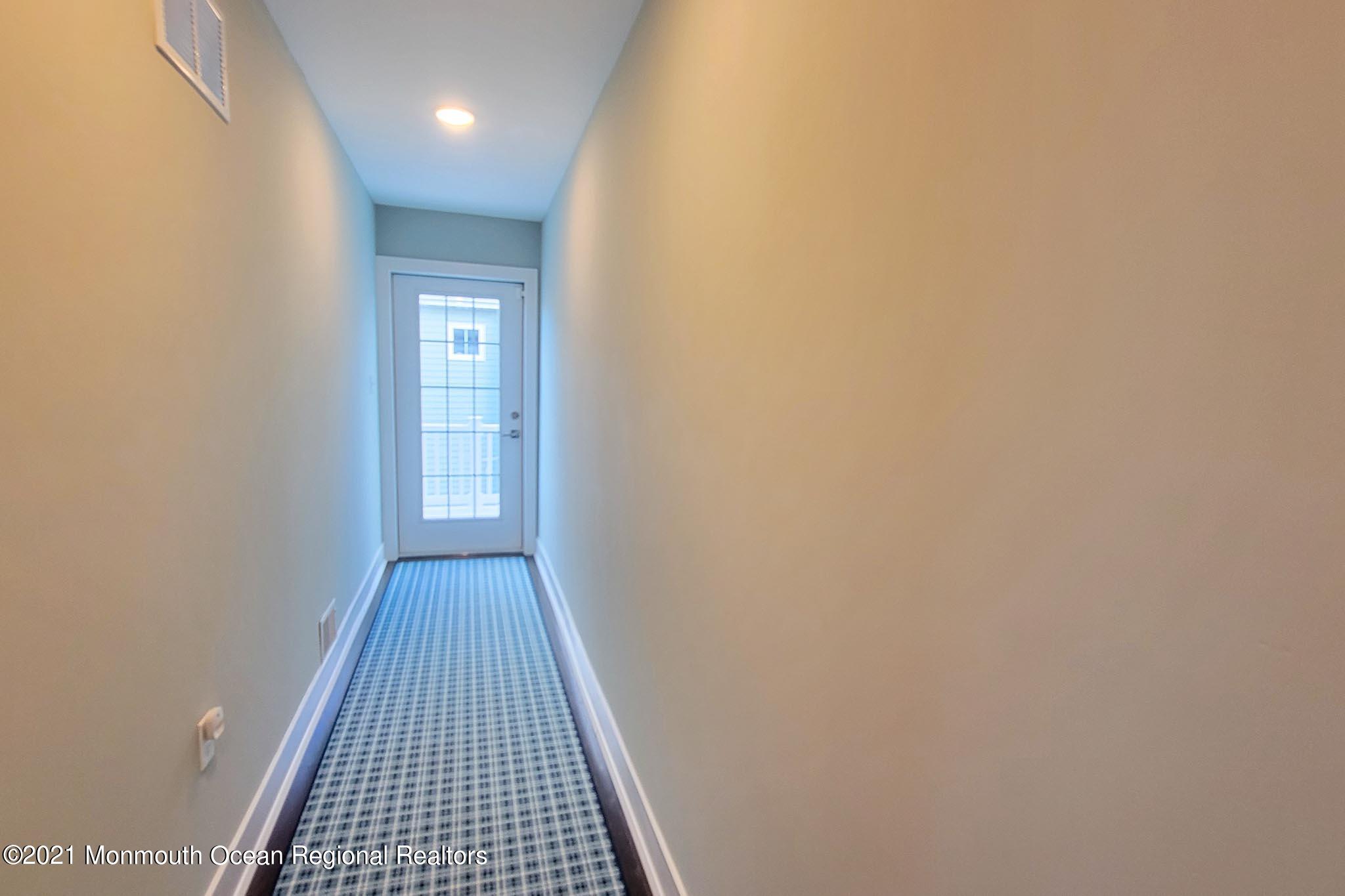 13 Surf Road Seaside Heights, NJ 08751 - Photo 42 of 64 a view of hallway with wooden floor