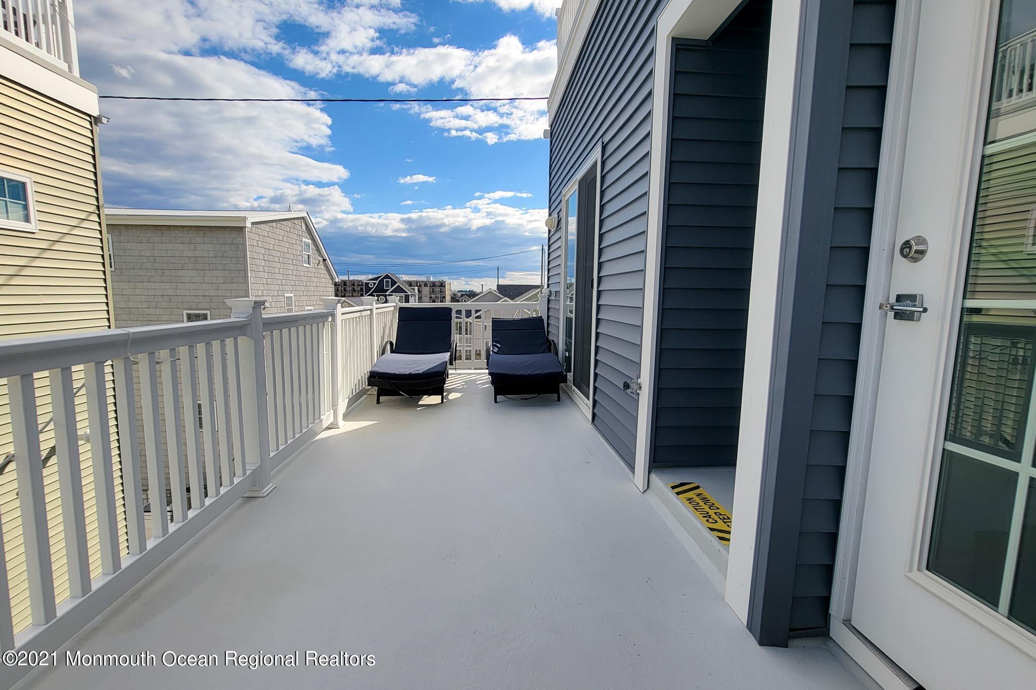 13 Surf Road Seaside Heights, NJ 08751 - Photo 44 of 64 a view of a balcony with furniture and city view