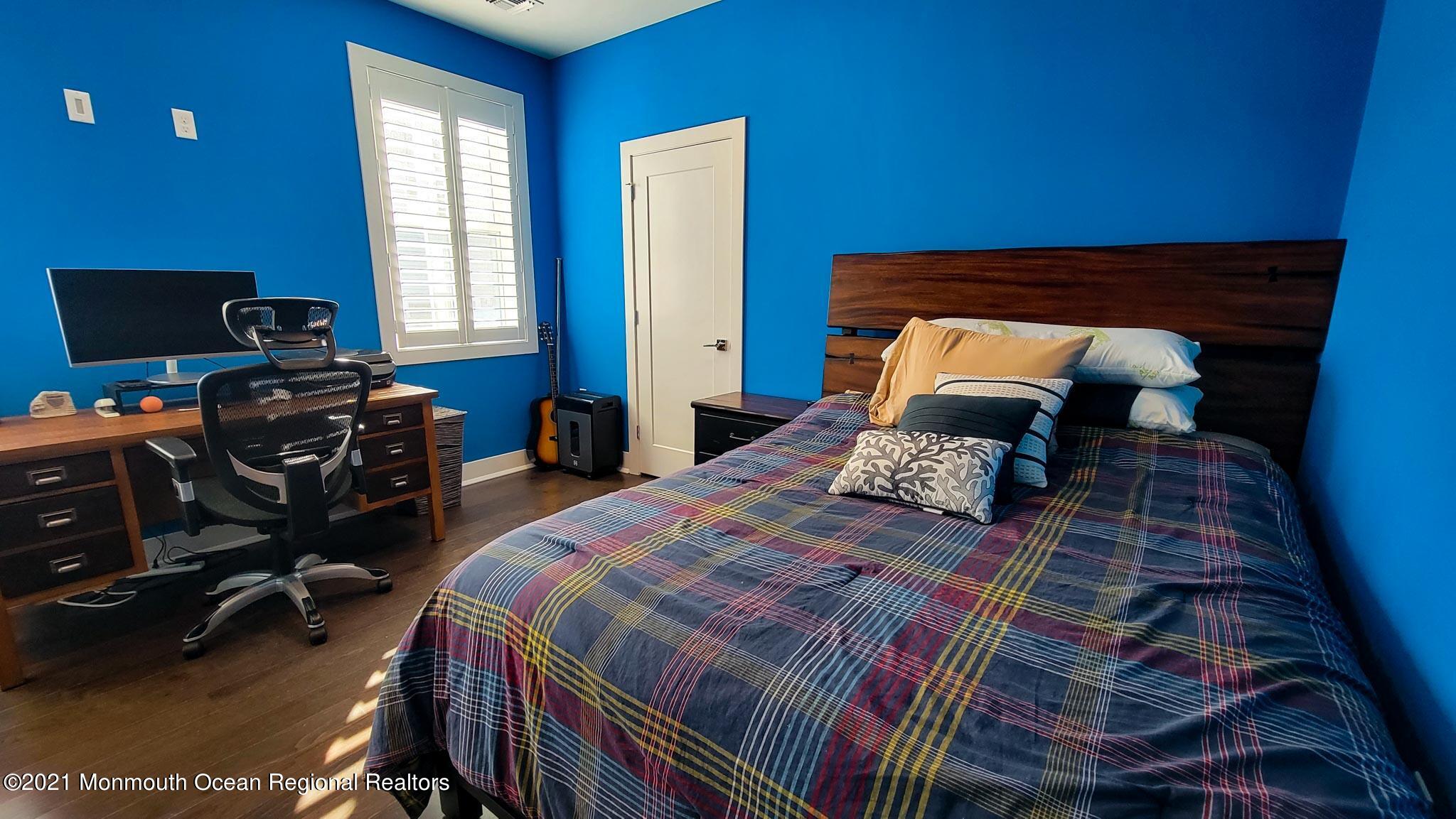 13 Surf Road Seaside Heights, NJ 08751 - Photo 47 of 64 a bedroom with a bed and a window
