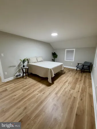 a bedroom with a bed and lamp