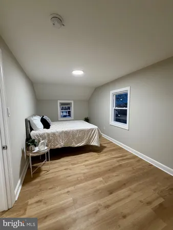 a bedroom with a bed and a table