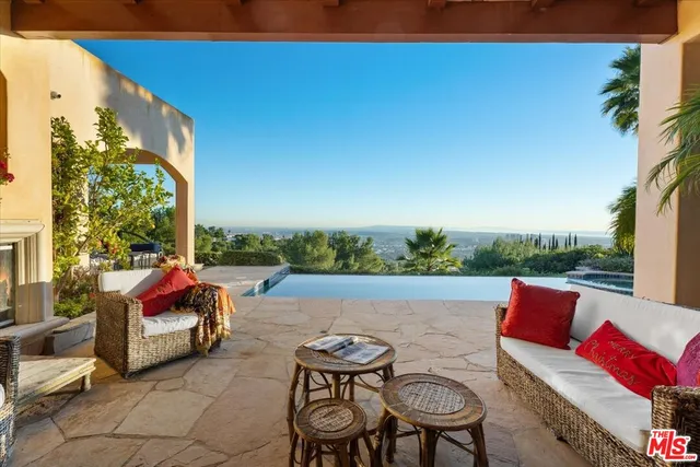 a outdoor living space with furniture and fireplace