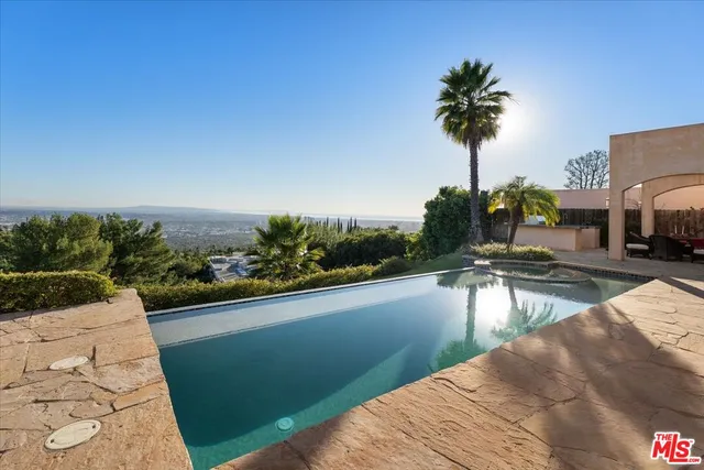 a view of a yard with an outdoor seating