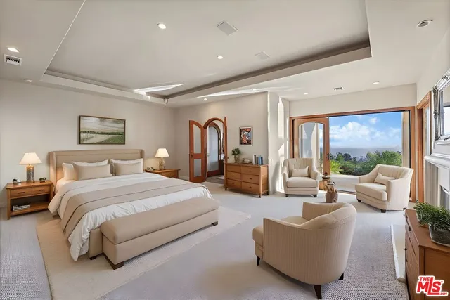 a bathroom with a double vanity sink and a large mirror
