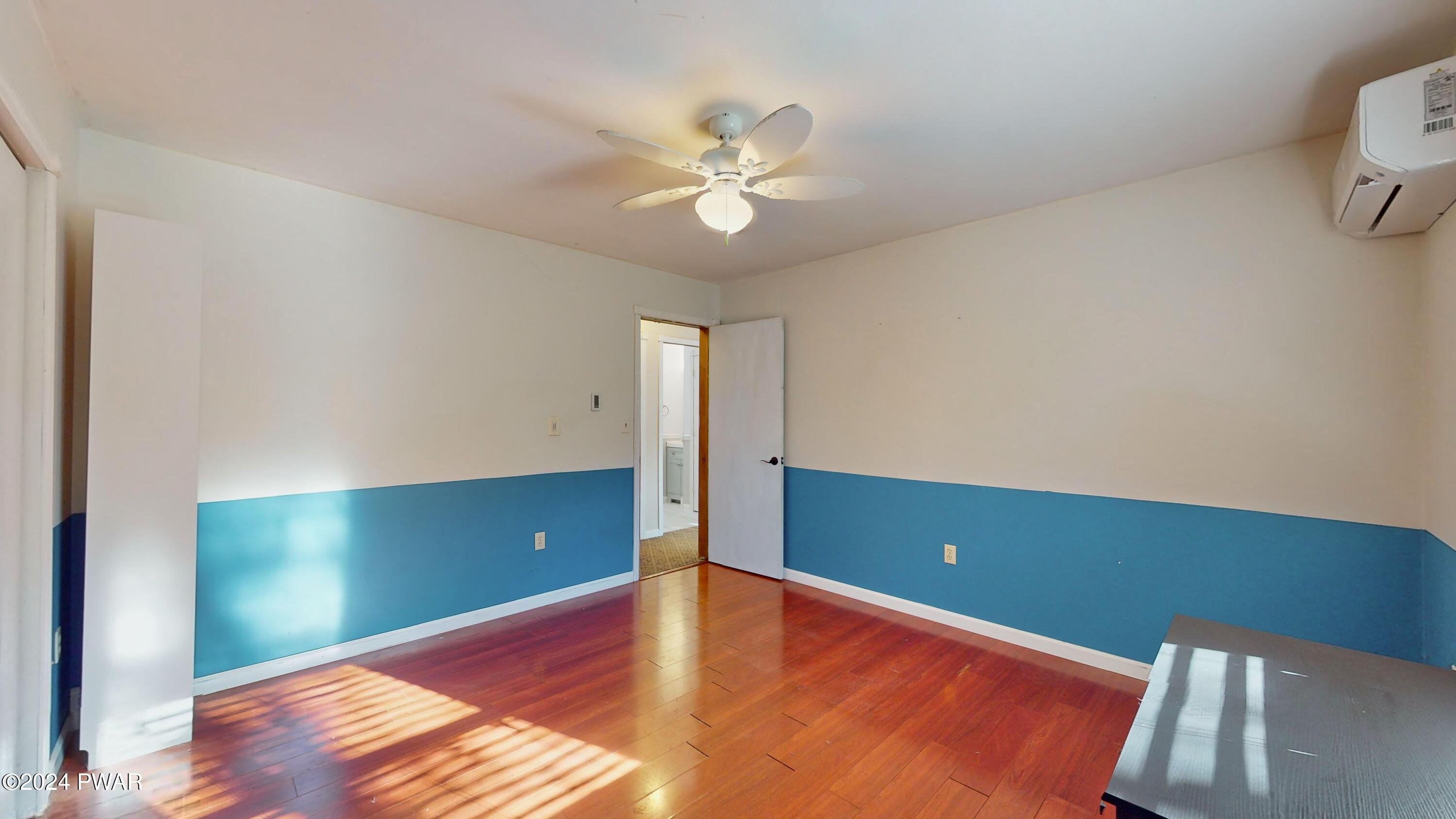 102 Maple Ridge Road Milford, PA 18337 - Photo 20 of 52 a view of a room with window and wooden floor