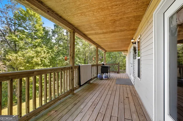 a view of balcony with wooden floor