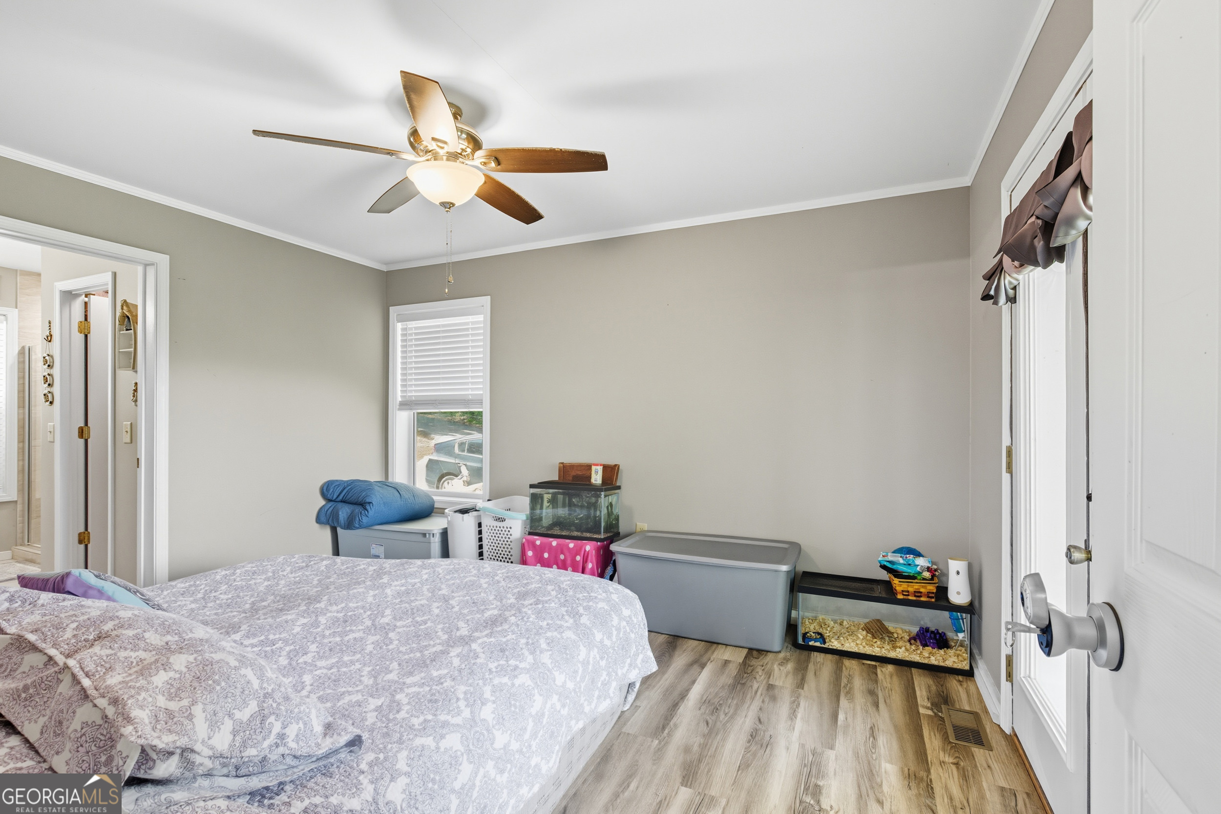 1947 Ivy Mountain Road Clarkesville, GA 30523 - Photo 16 of 48 a bedroom with a bed and a chandelier