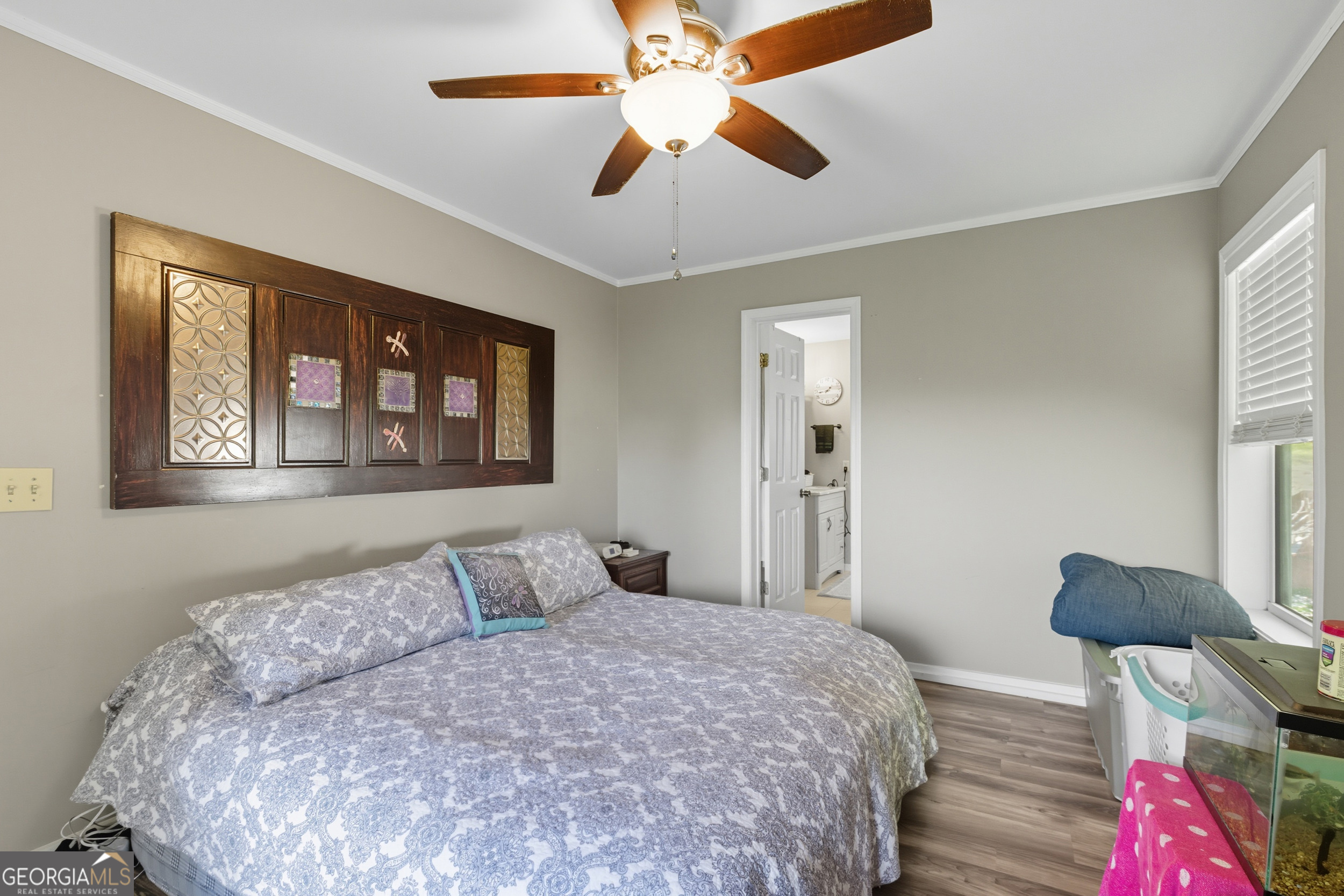 1947 Ivy Mountain Road Clarkesville, GA 30523 - Photo 17 of 48 a bedroom with a bed and a chandelier