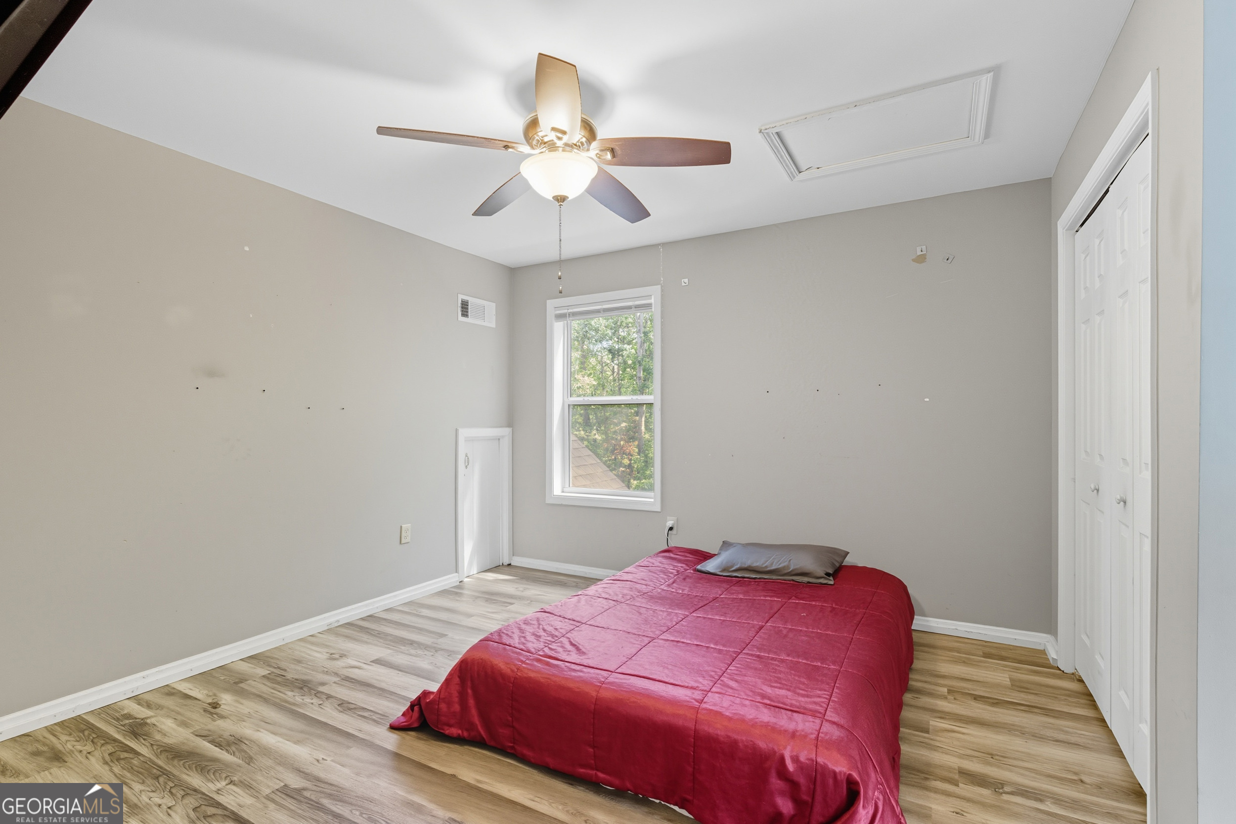 1947 Ivy Mountain Road Clarkesville, GA 30523 - Photo 24 of 48 a bedroom with a bed and a chandelier