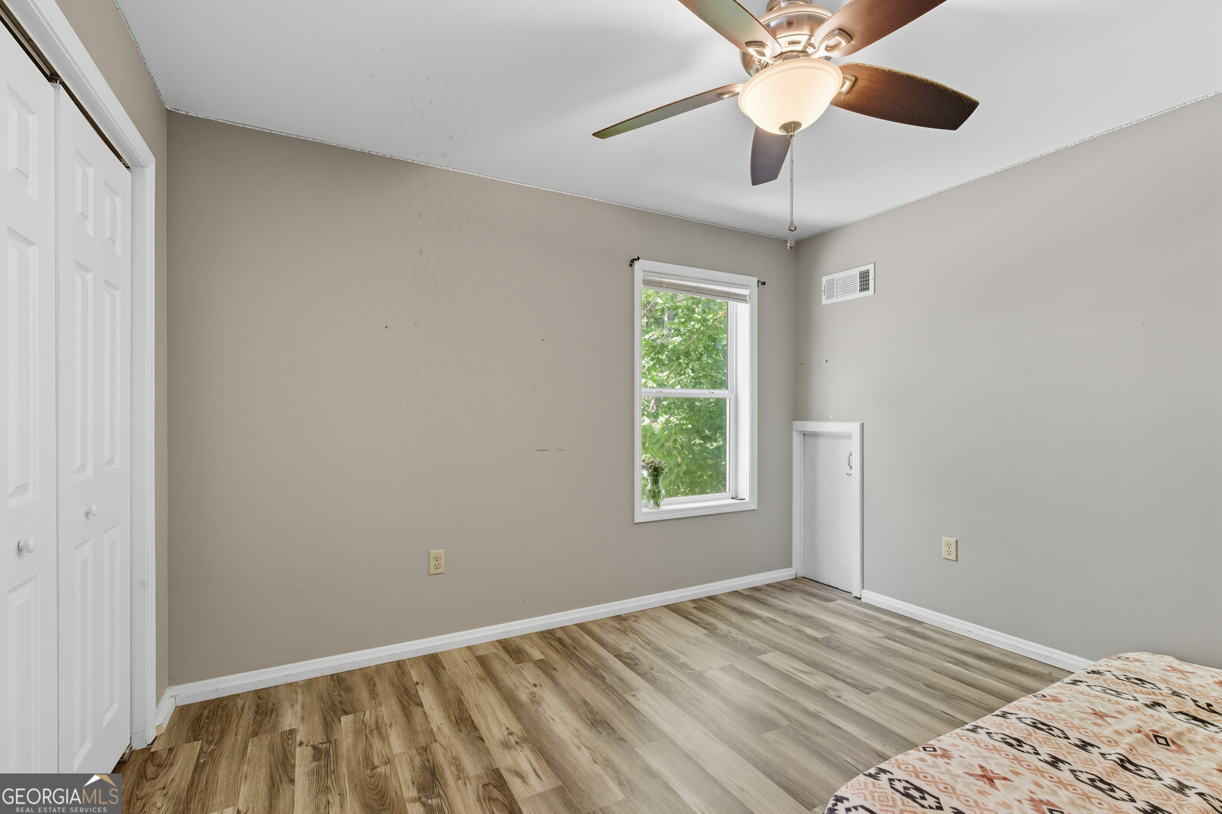 1947 Ivy Mountain Road Clarkesville, GA 30523 - Photo 26 of 48 wooden floor in an empty room with a window