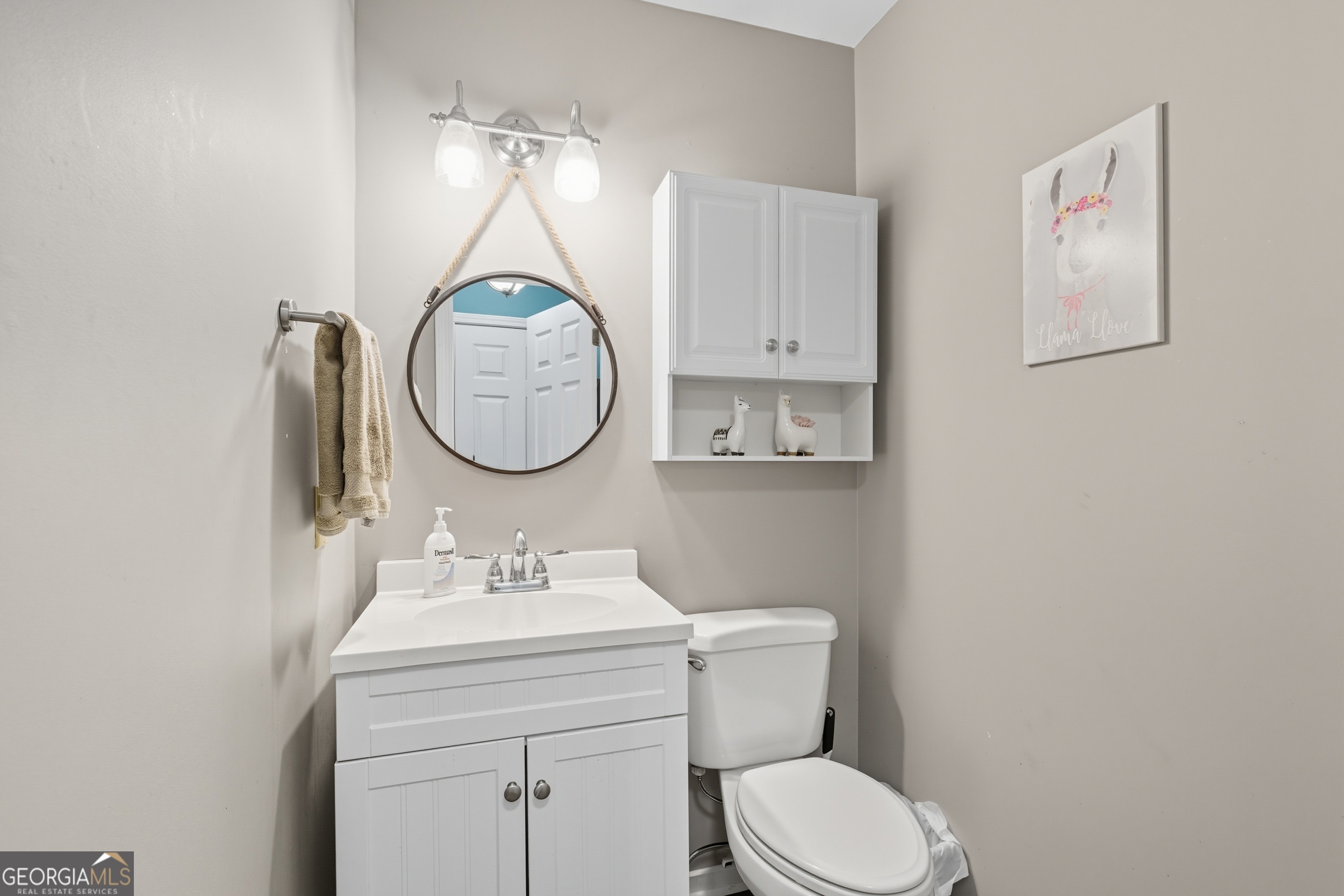 1947 Ivy Mountain Road Clarkesville, GA 30523 - Photo 28 of 48 a bathroom with a toilet a sink and a mirror