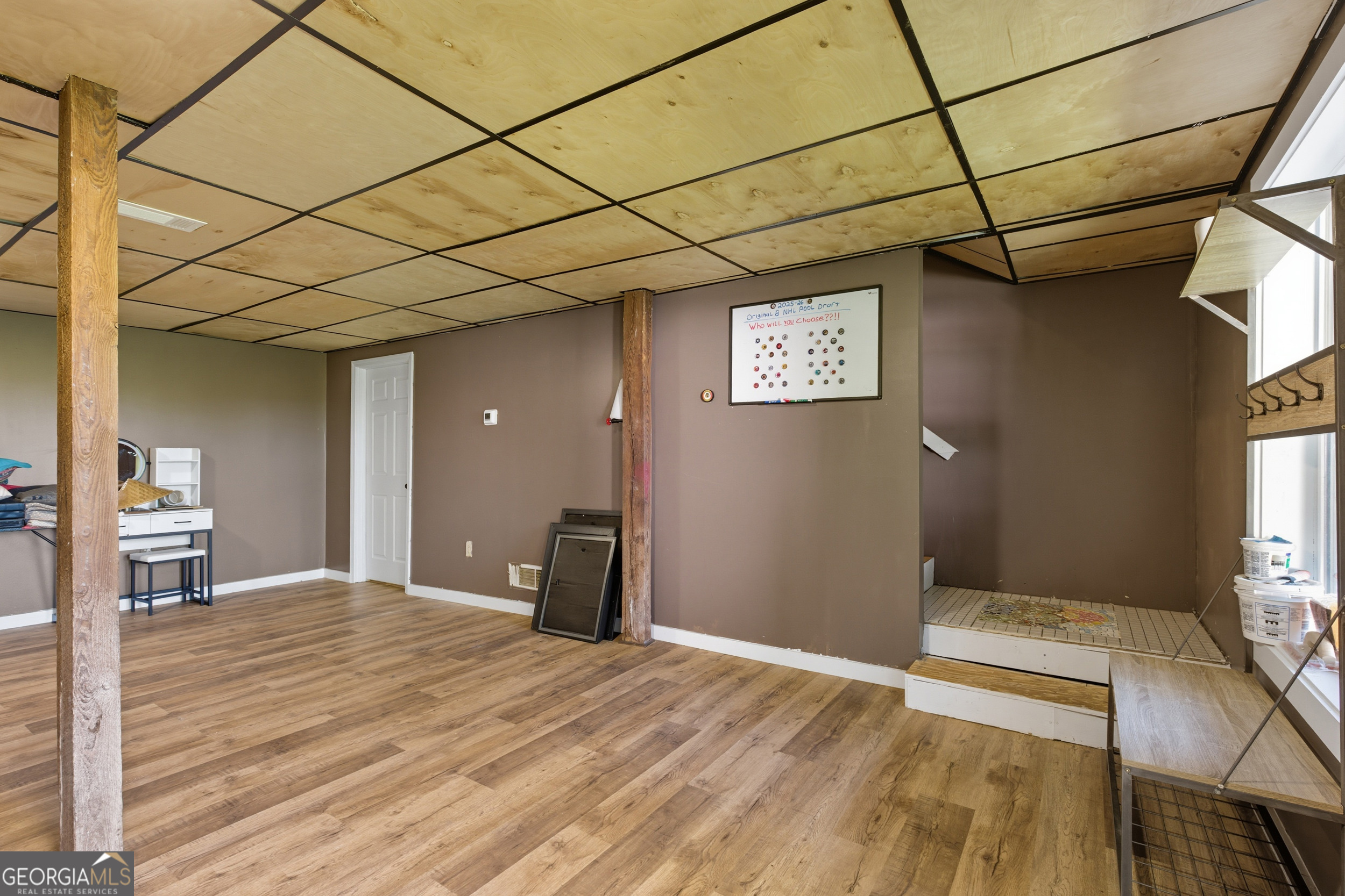 1947 Ivy Mountain Road Clarkesville, GA 30523 - Photo 29 of 48 a bedroom with a bed and a chandelier