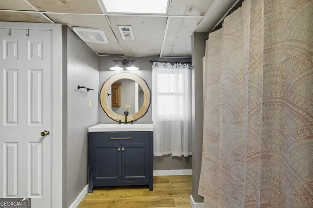 a bathroom with a sink and a mirror
