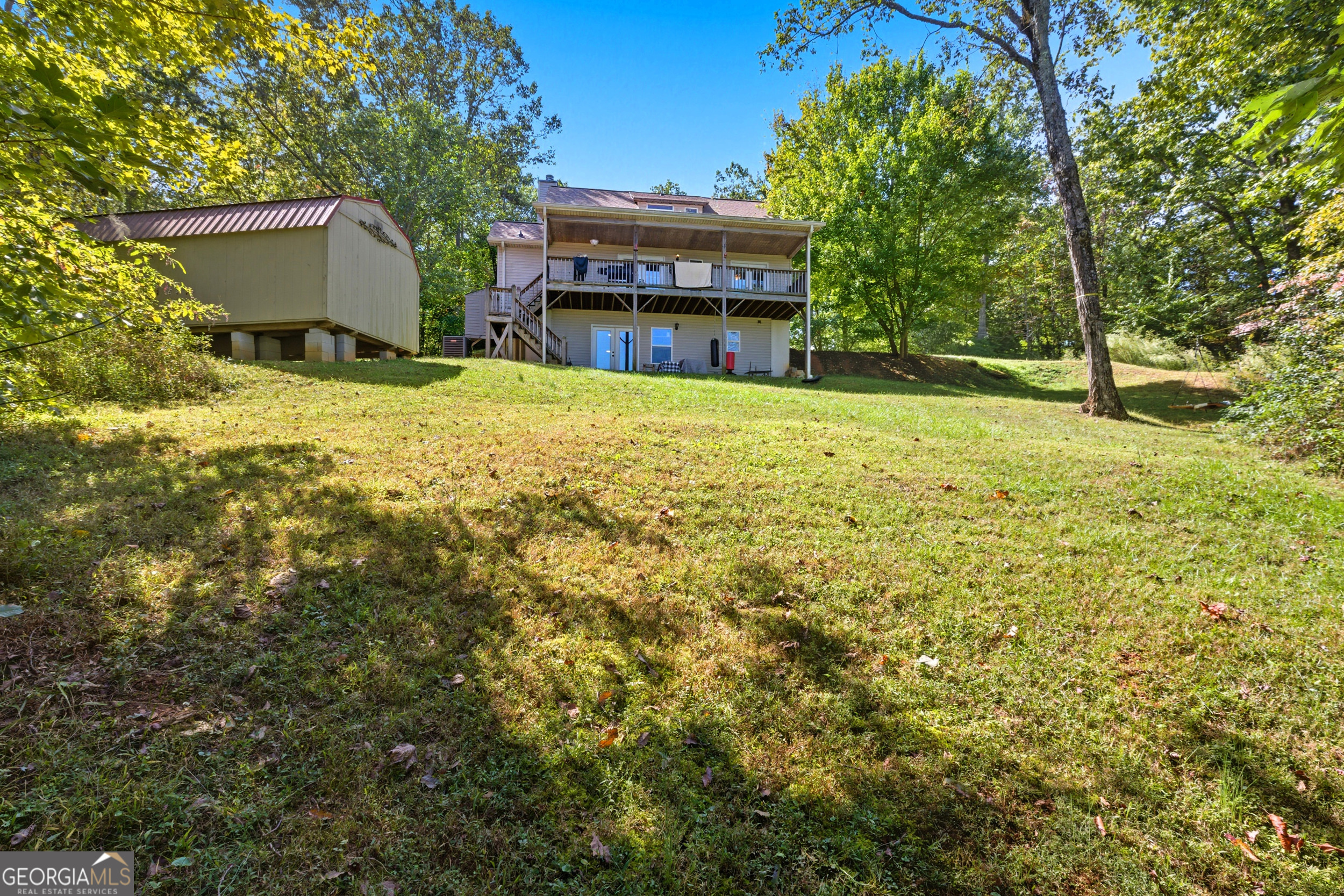 1947 Ivy Mountain Road Clarkesville, GA 30523 - Photo 35 of 48 a view of a house with a yard