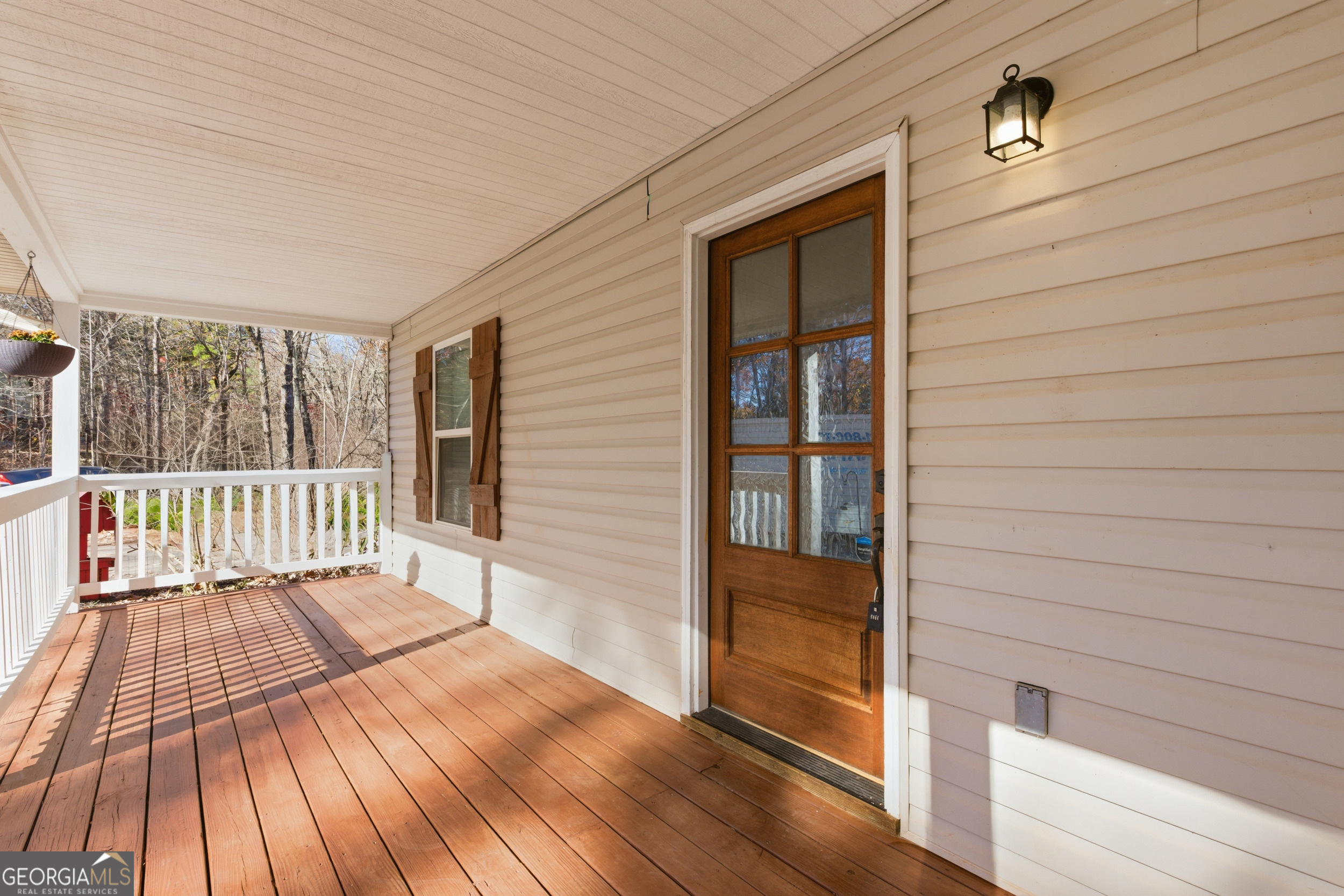 1947 Ivy Mountain Road Clarkesville, GA 30523 - Photo 5 of 48 a view of deck with a floor to ceiling window and wooden floor
