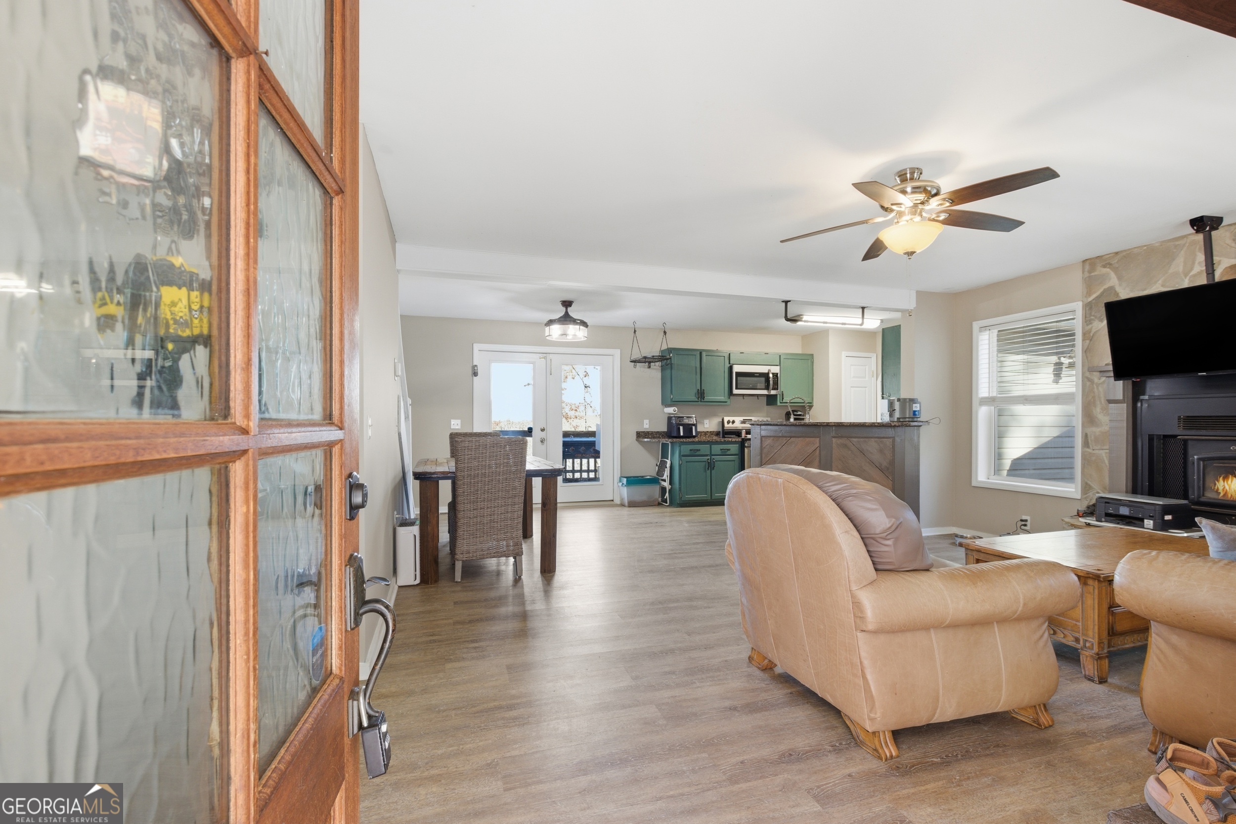 1947 Ivy Mountain Road Clarkesville, GA 30523 - Photo 6 of 48 a living room with furniture a fireplace and a flat screen tv
