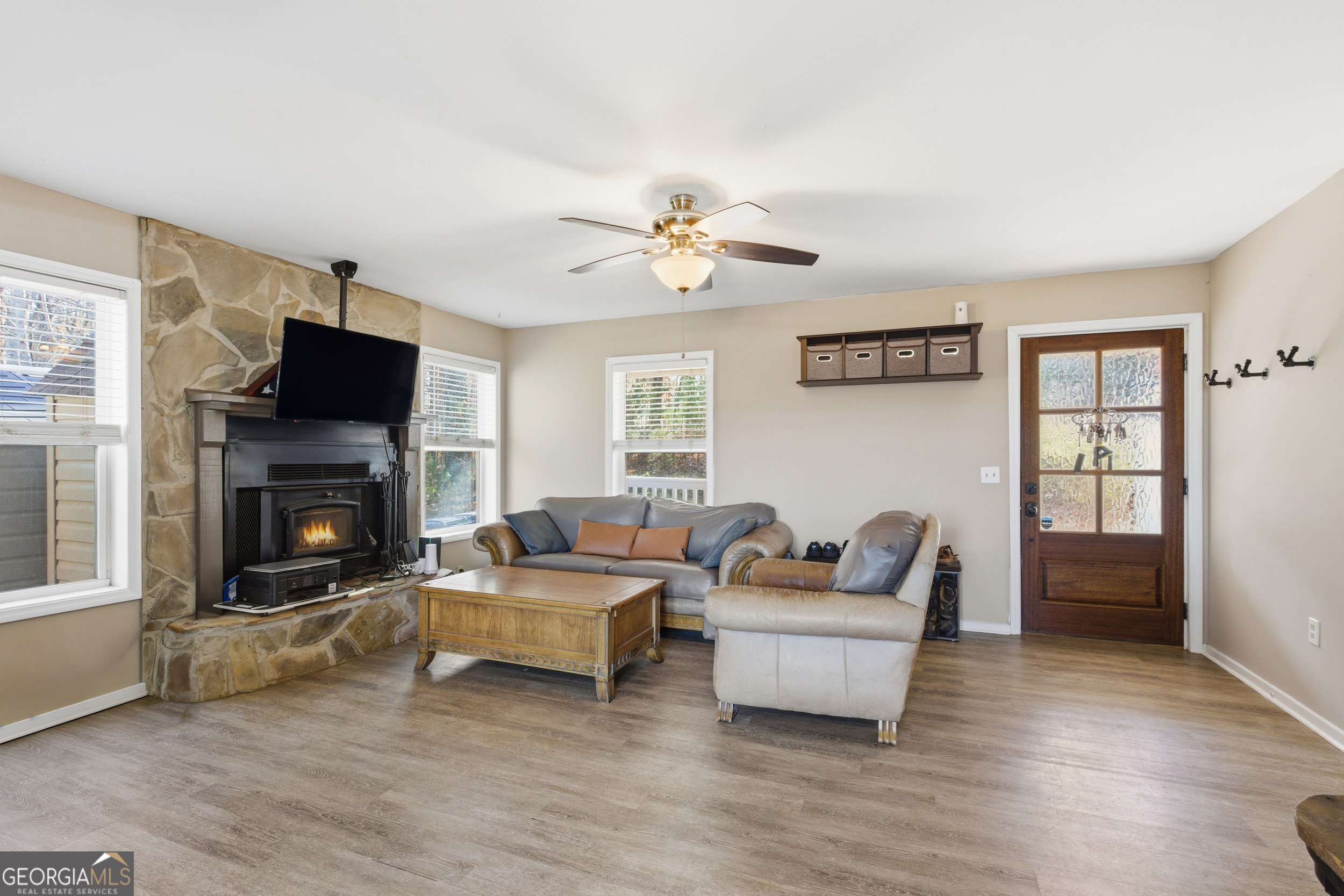 1947 Ivy Mountain Road Clarkesville, GA 30523 - Photo 7 of 48 a living room with furniture and a fireplace