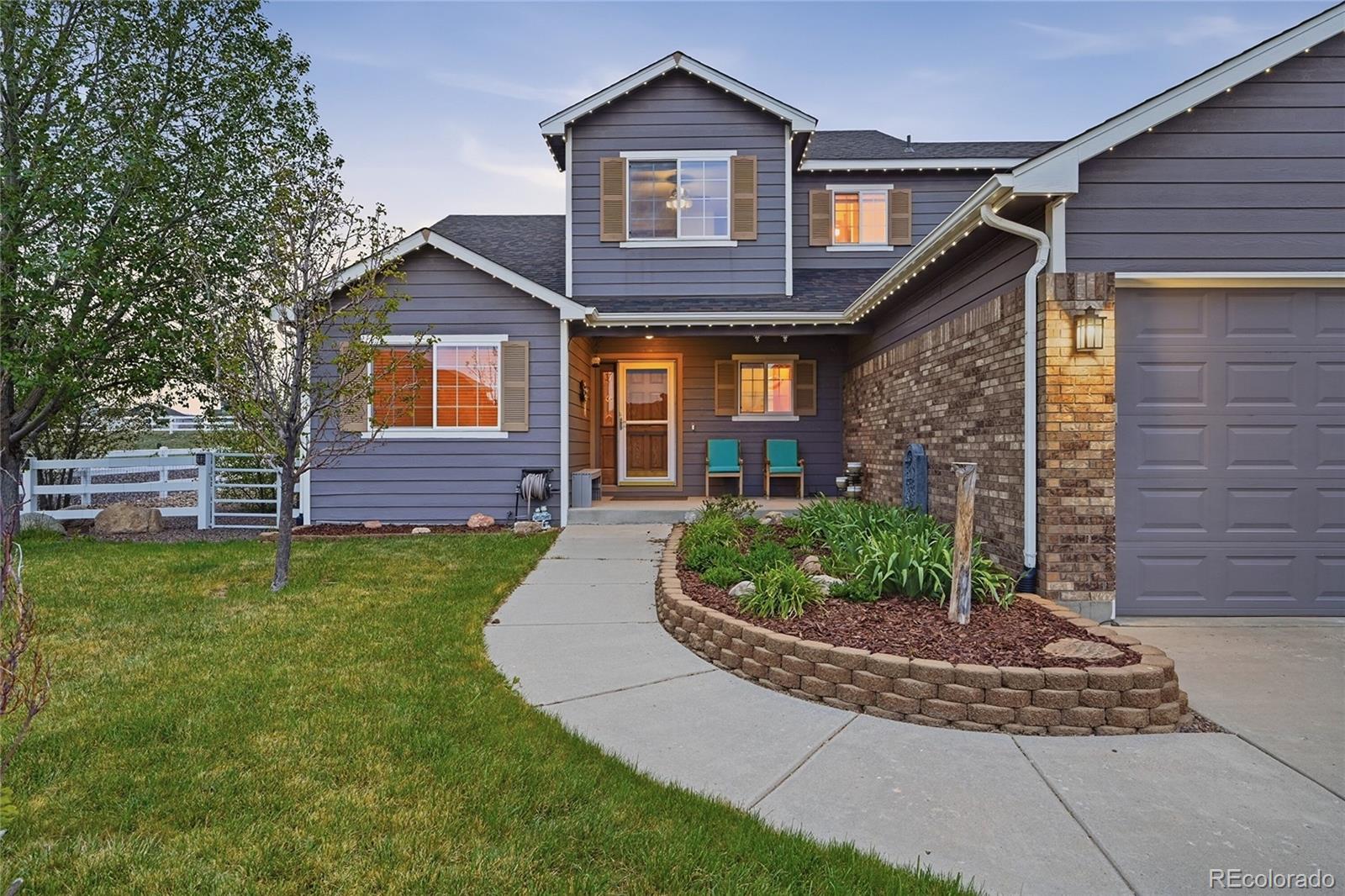 9288 Rockingham Drive Peyton, CO 80831 - Photo 41 of 49 a front view of a house with a yard