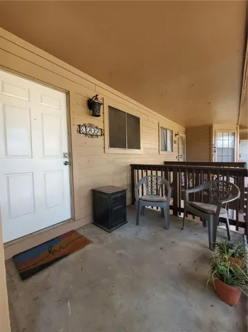 a hallway with a table and chairs