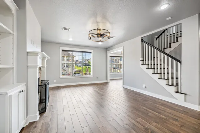 a view of an entryway with wooden floor