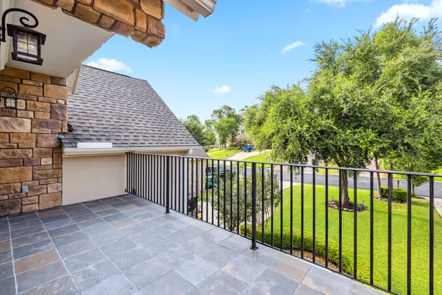 a view of a patio with a table and chairs
