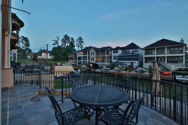 a view of a house with swimming pool and sitting area