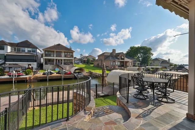 a view of a balcony with wooden fence