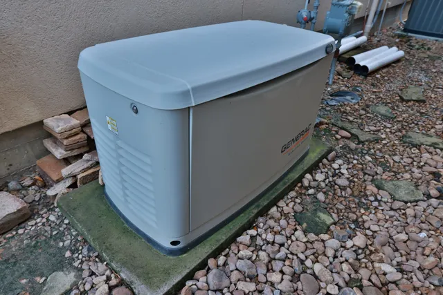 a wooden bench sitting in front of building