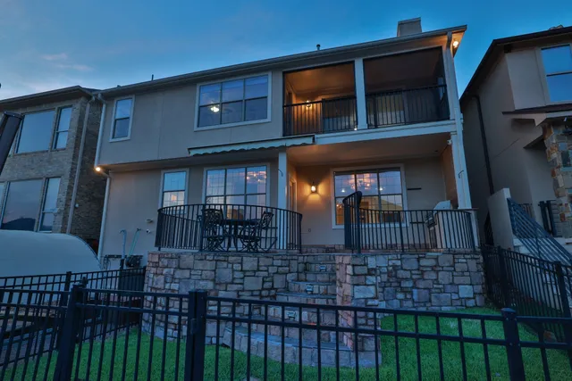a front view of a house with swimming pool having outdoor seating