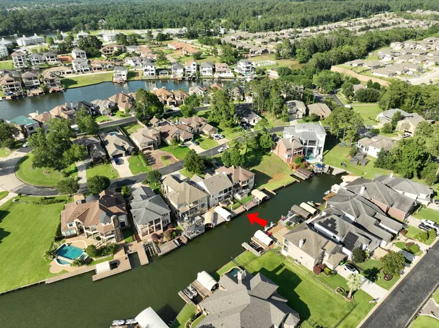 an aerial view of a house with a lake view